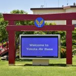Tori gate with Welcome to Yokota Air Base in Japan