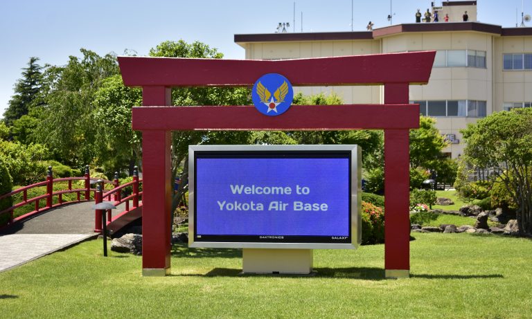 Tori gate with Welcome to Yokota Air Base in Japan